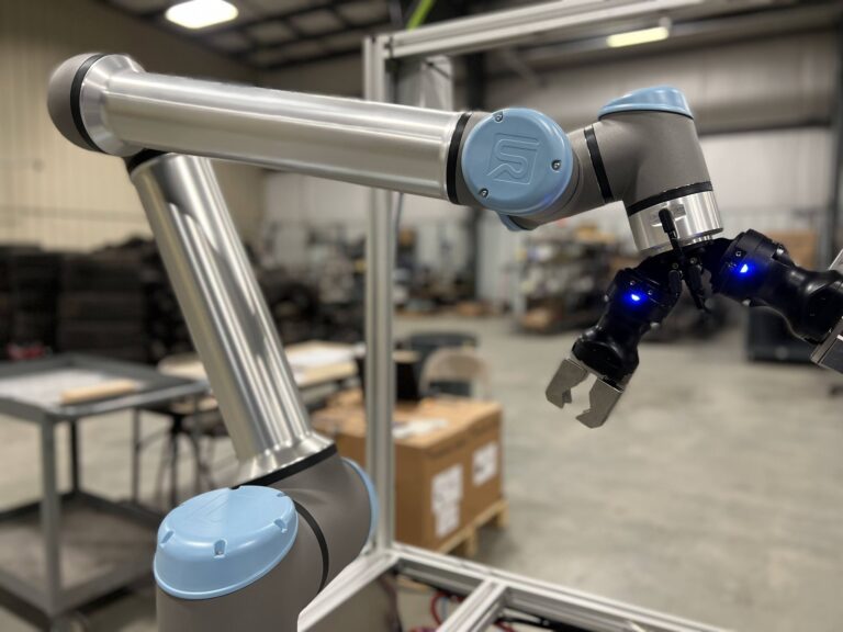 Collaborative robot with custom gripper tooling in a manufacturing facility